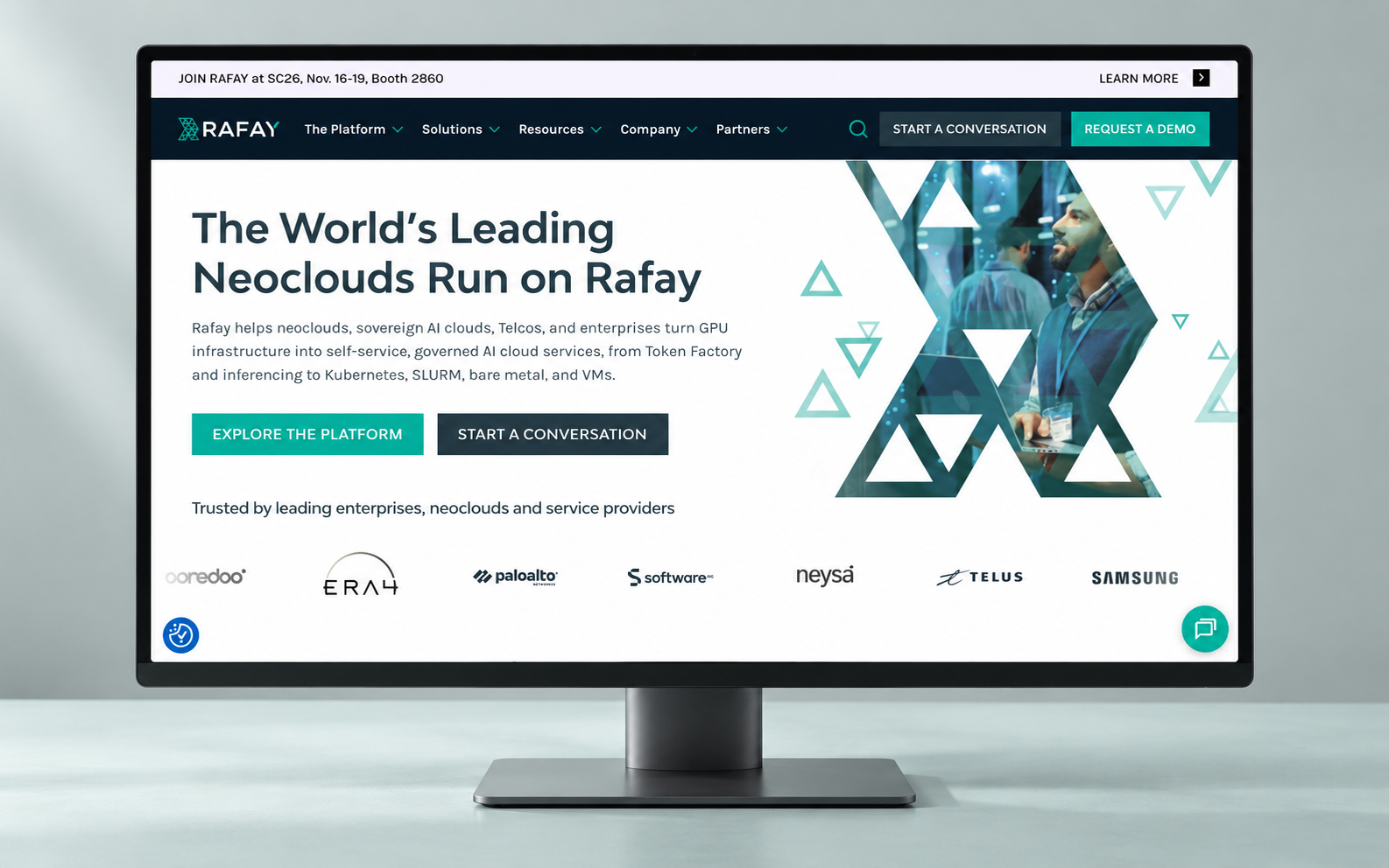 Rafay’s teal and navy website displayed on a desktop monitor in a pale mint-grey studio.
